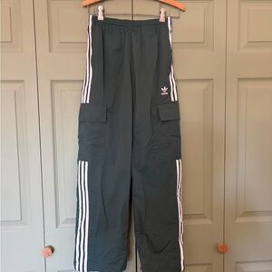 Adidas Dark Green sweats with White Stripes.